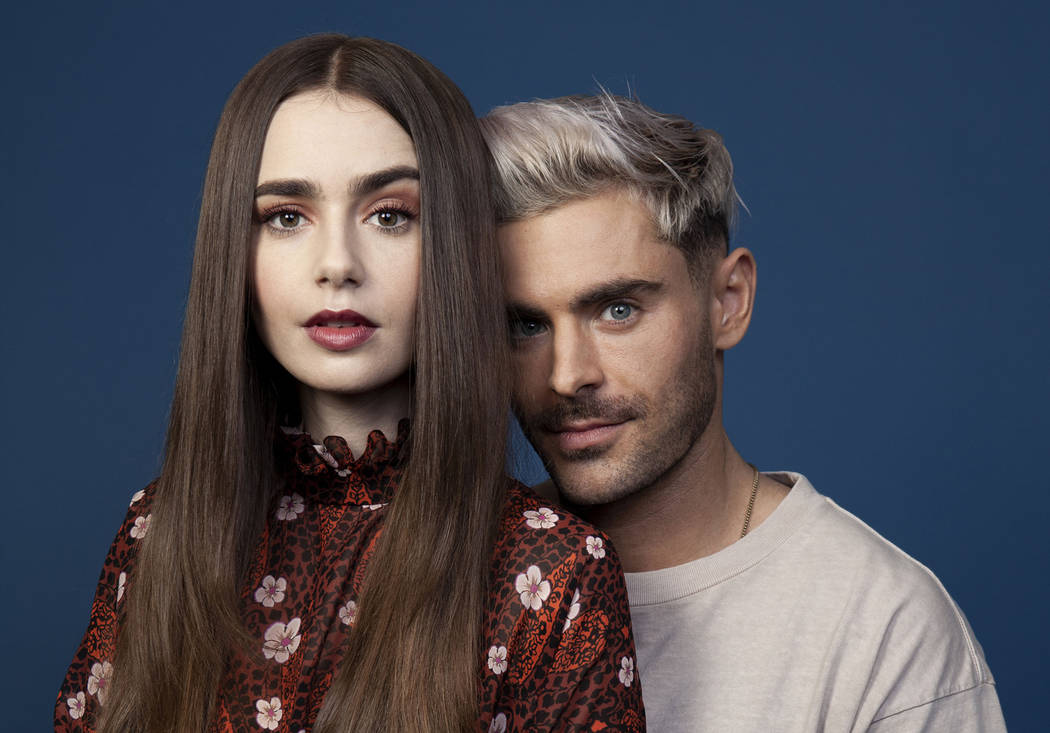 This April 22, 2019 photo shows Zac Efron, right, and Lily Collins posing for a portrait at the ...