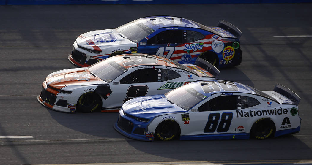 Chase Elliott (9) leads Alex Bowman (88) and Ryan Preece (47) to the finish line to win a NASCA ...