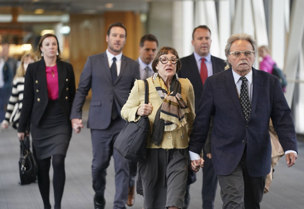 Justine Damond's family heads into the Hennepin County Government Center in Minneapolis, Tuesda ...