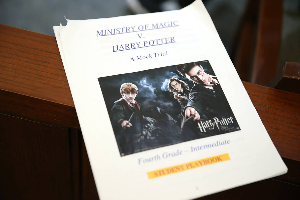 A copy of a Harry Potter student play books sits inside the courtroom for a fourth grade mock t ...