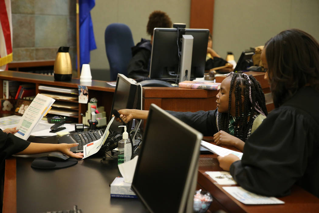 Alejah McCraney, 10, presents evidence during a mock trial at the Regional Justice Center in La ...