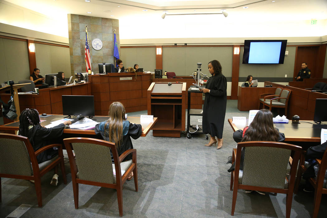 Judge Tierra Jones, center, speaks to students during a mock trial at the Regional Justice Cent ...