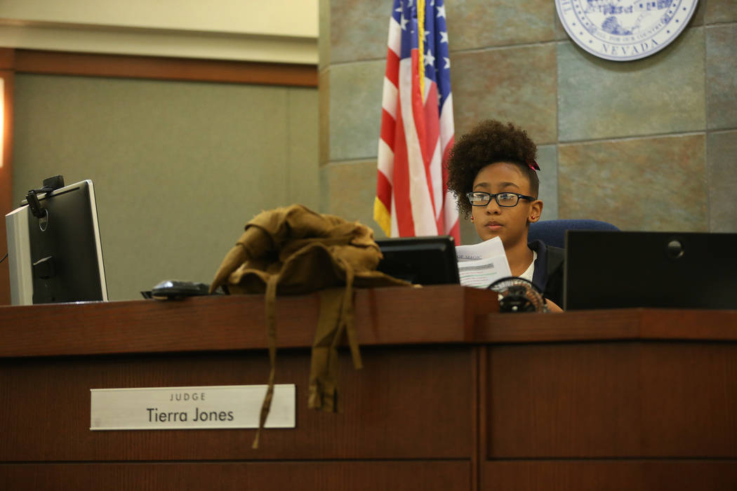 Aleksa Nunez, 9, in character as a court judge, participates during a mock trial at the Regiona ...