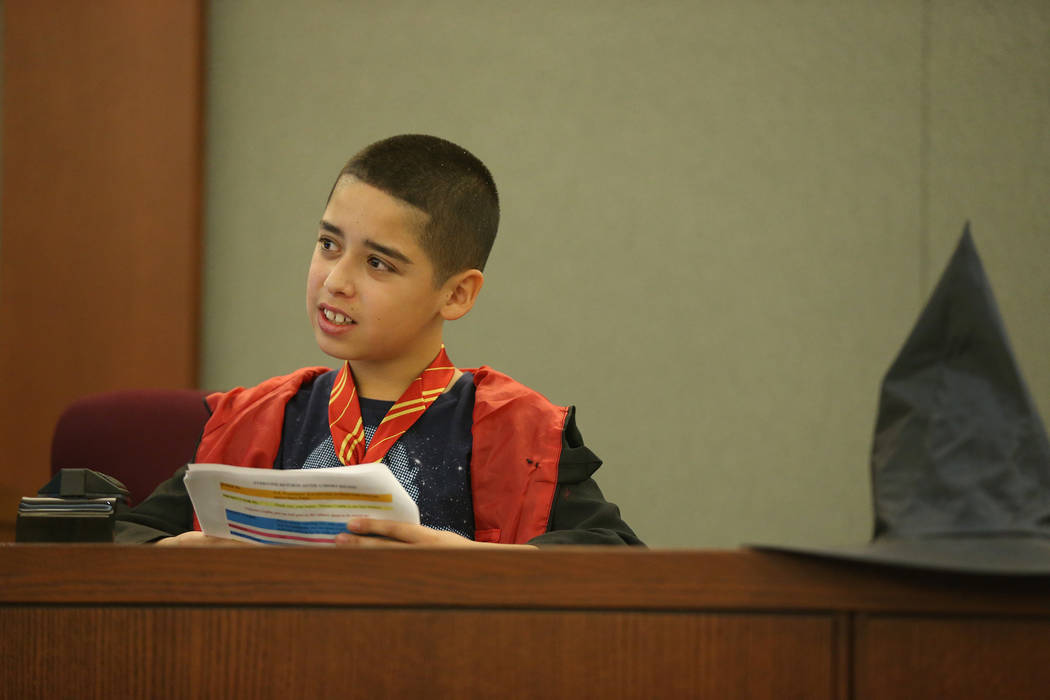 Mario Hernandez, 10, speaks on the witness stand during a mock trial at the Regional Justice Ce ...