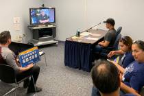 Joey Cruz, center right, is joined Thursday by others from the Make the Road Nevada at the Gran ...