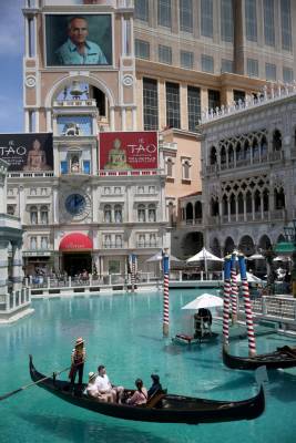 Portraits of founding employees are displayed on The Venetian marquee to celebrate the 20th ann ...