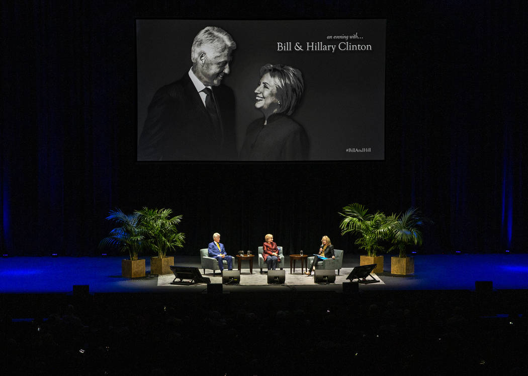 Former U.S. President Bill Clinton and former U.S. Secretary of State Hillary Clinton take thei ...