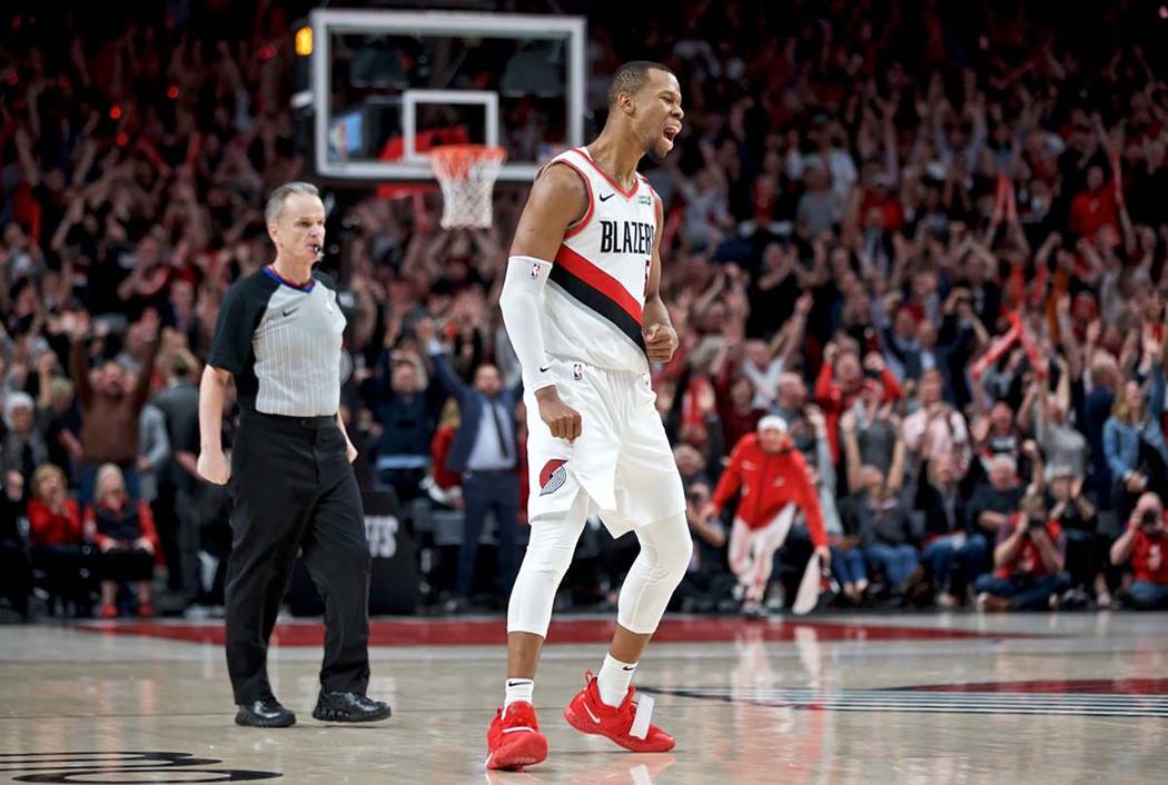 Portland Trail Blazers guard Rodney Hood reacts after making a three point basket against the D ...