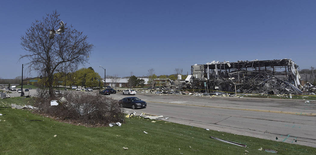 Debris is stuck in trees across the street at the scene of an explosion at AB Specialty Silicon ...