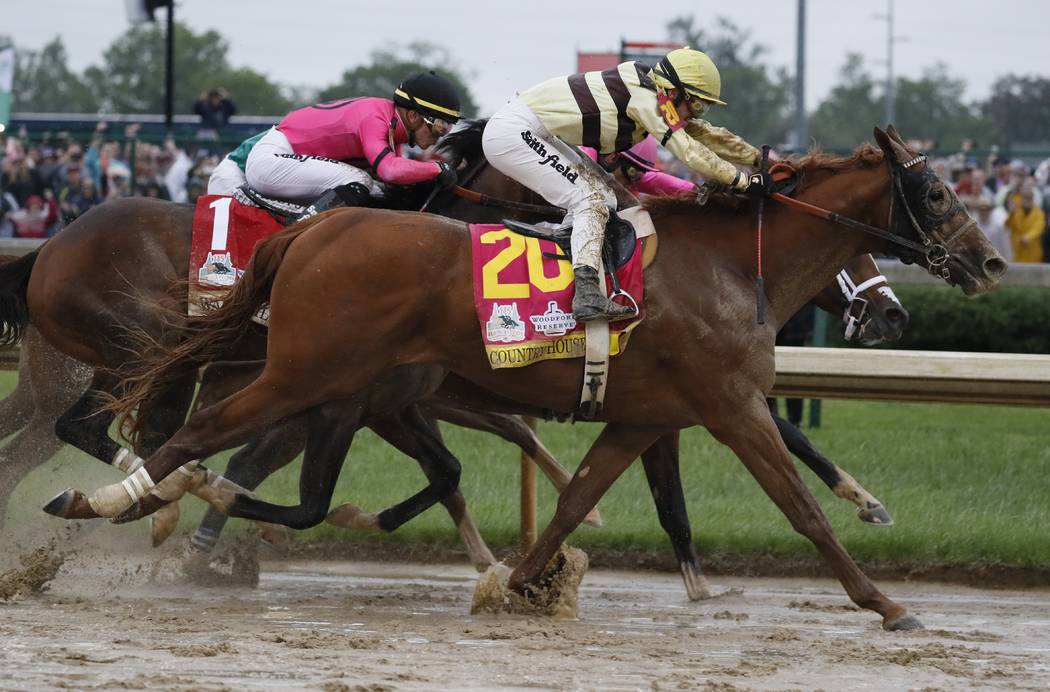 Flavien Prat rides Country House to victory during the 145th running of the Kentucky Derby hors ...