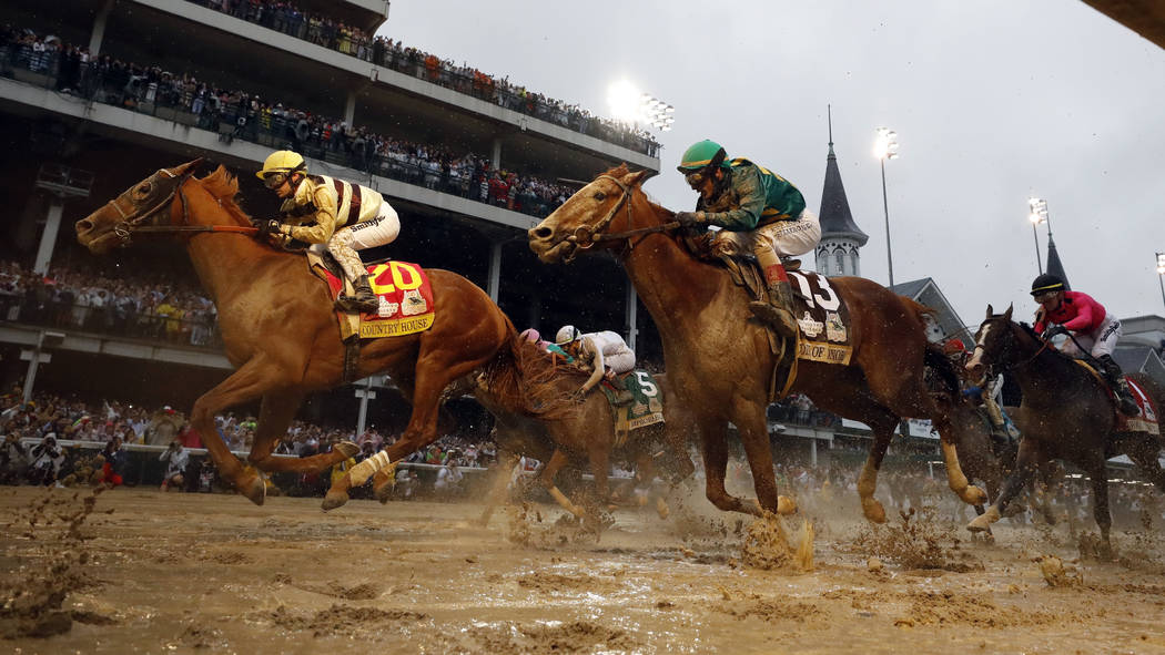 Flavien Prat rides Country House to victory during the 145th running of the Kentucky Derby hors ...