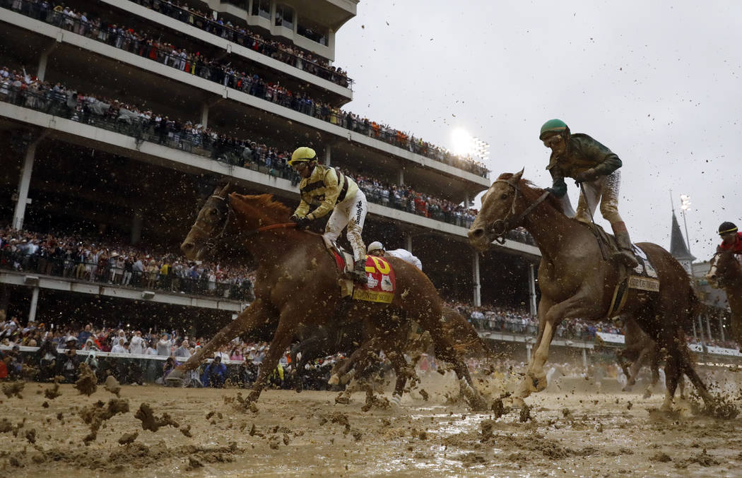 Flavien Prat rides Country House to the finish line during the 145th running of the Kentucky De ...