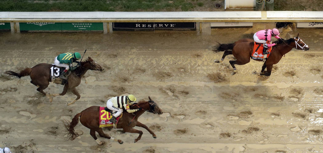 Luis Saez rides Maximum Security across the finish line first followed by Flavien Prat on Count ...