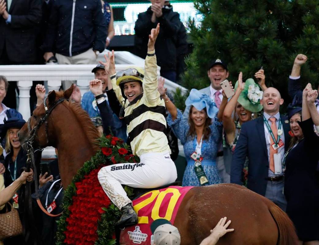 Flavien Prat celebrates after riding Country House to victory during the 145th running of the K ...