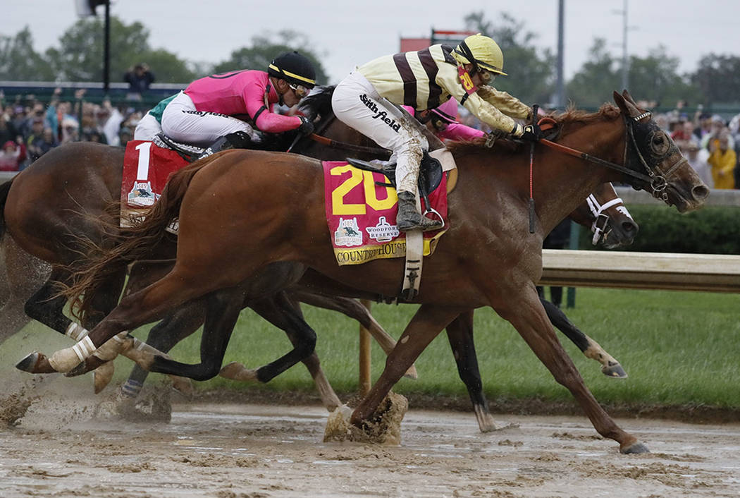 Flavien Prat rides Country House to victory during the 145th running of the Kentucky Derby hors ...