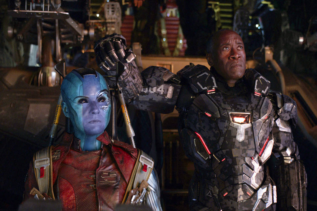 This image released by Disney shows Karen Gillan, left, and Don Cheadle in a scene from "A ...