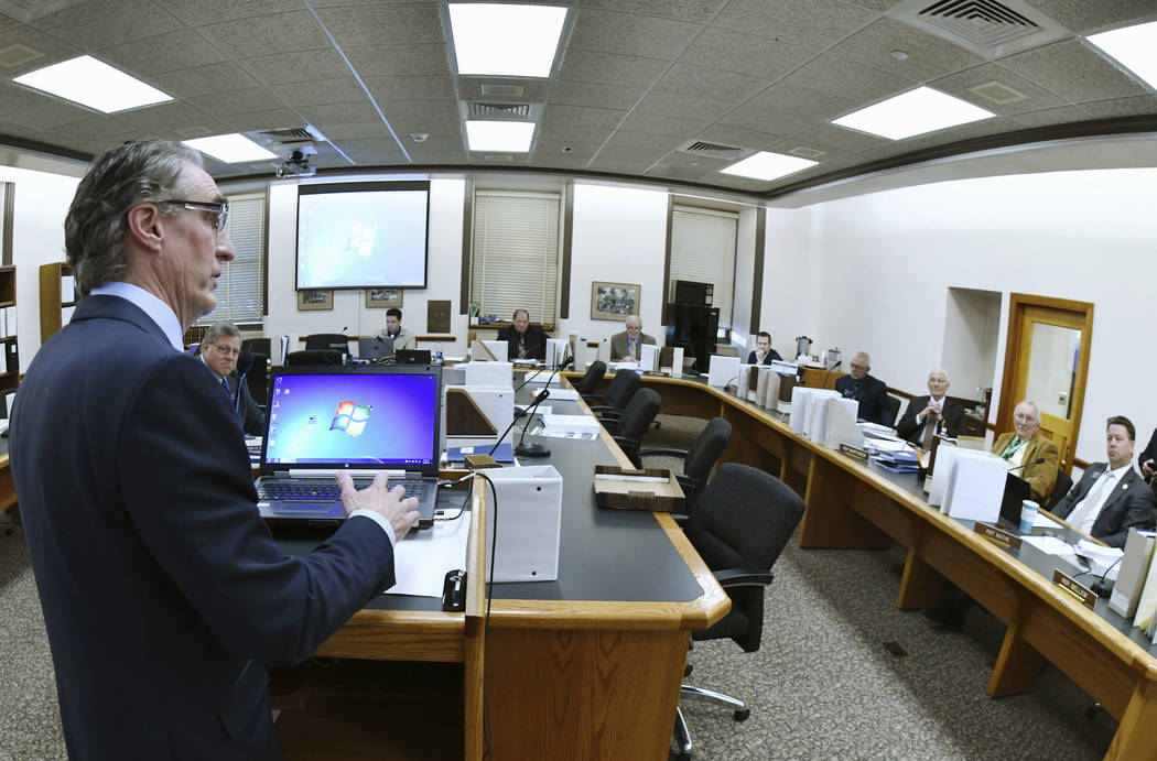 FILE - In this Jan. 9, 2019, file photo, North Dakota Gov. Doug Burgum, left, answers question ...