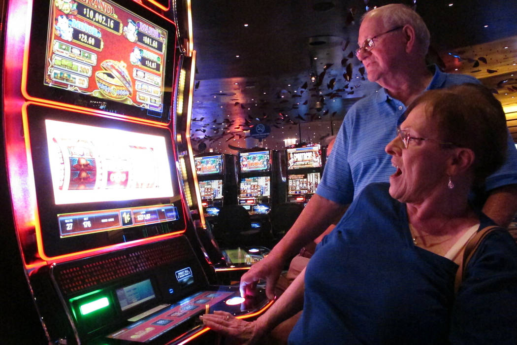 In this June 25, 2018 photo, Joyce Green of Vineland, N.J. reacts to a winning spin at a slot m ...