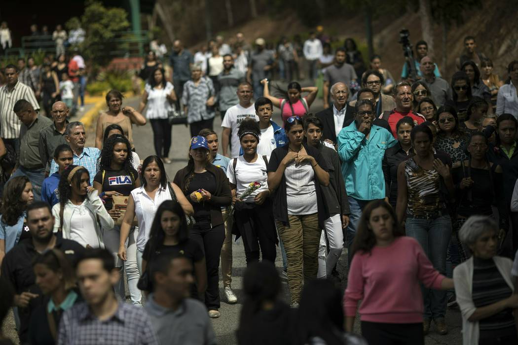 Friends and family take part in the funeral procession for Yhoifer Jesus Hernandez Vazquez, 14, ...