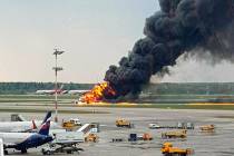 In this image provided by Riccardo Dalla Francesca shows smoke rises from a fire on a plane at ...