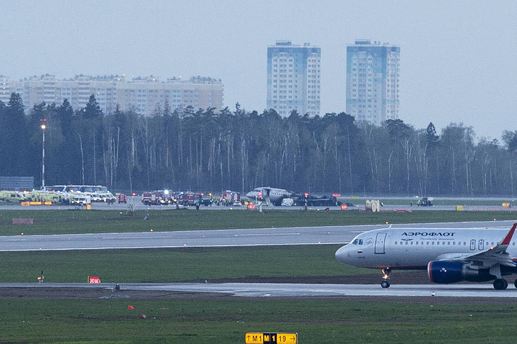 The Sukhoi SSJ-100 aircraft of Aeroflot Airlines, center, is seen after an emergency landing in ...