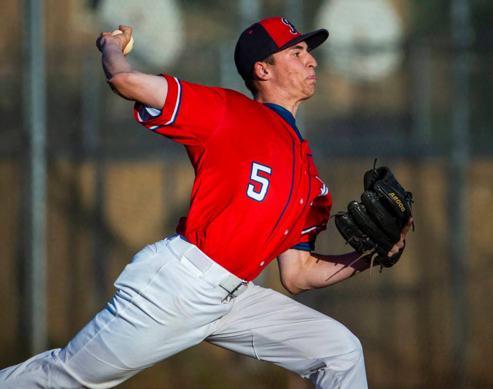 Liberty' pitcher Garrett Maloney (5) finishes off Spring Valley during the first round of the D ...