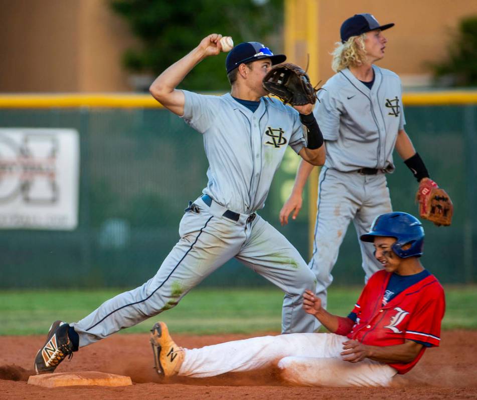 Spring Valley's (5, not on roster) makes the tag at second base as Liberty's Ryan Towers (14) ...