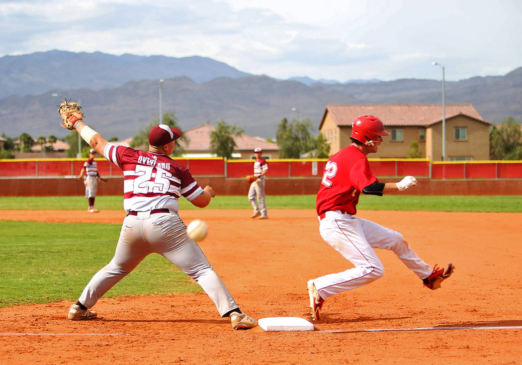 Arbor View's (12) makes it safe to first as Cimarron-Memorial's Mike Overland (25) tries to cat ...