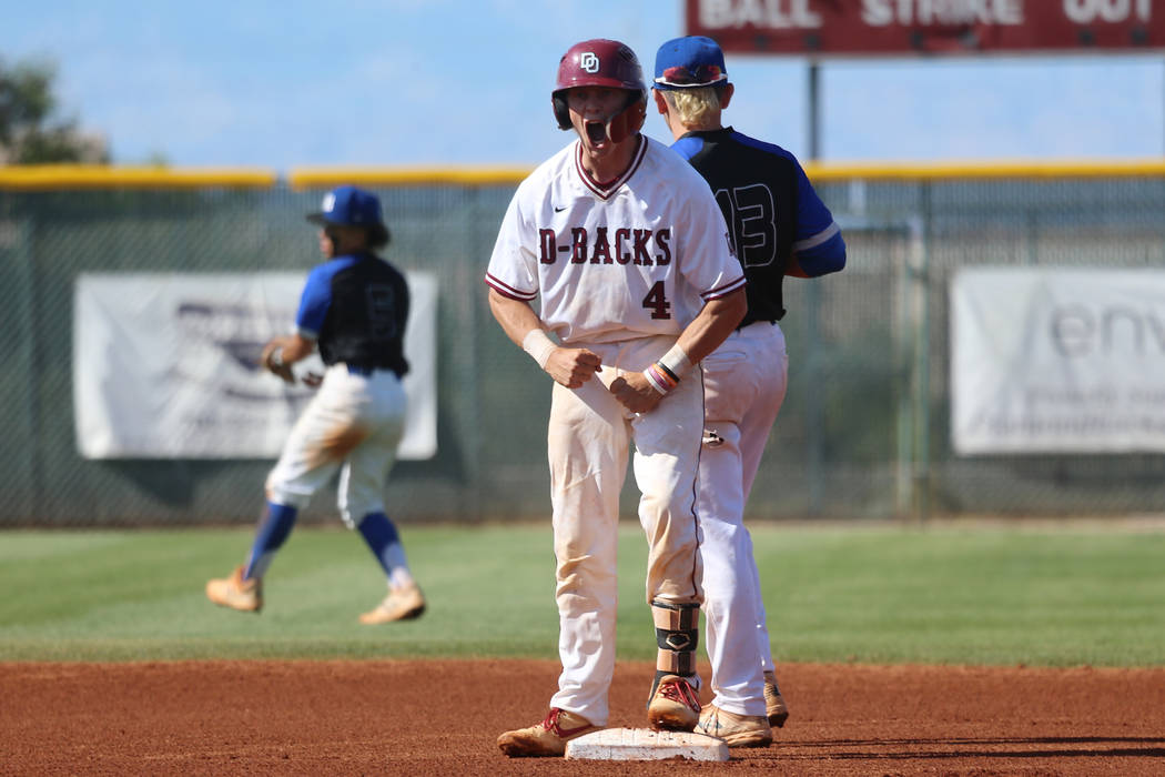 Desert Oasis' Parker Schmidt (4) reacts after hitting a double against Basic in the Desert Regi ...