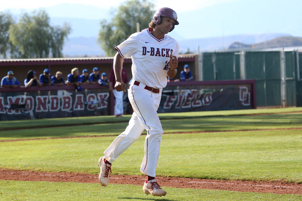 Desert Oasis' Campbell Holt (16) runs the bases after hitting a two run homer against Basic in ...