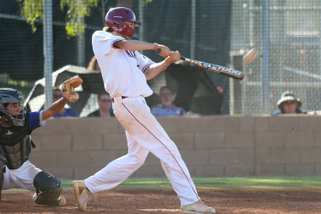 Desert Oasis' Campbell Holt (15) his a solo homer against Basic in the Desert Region championsh ...