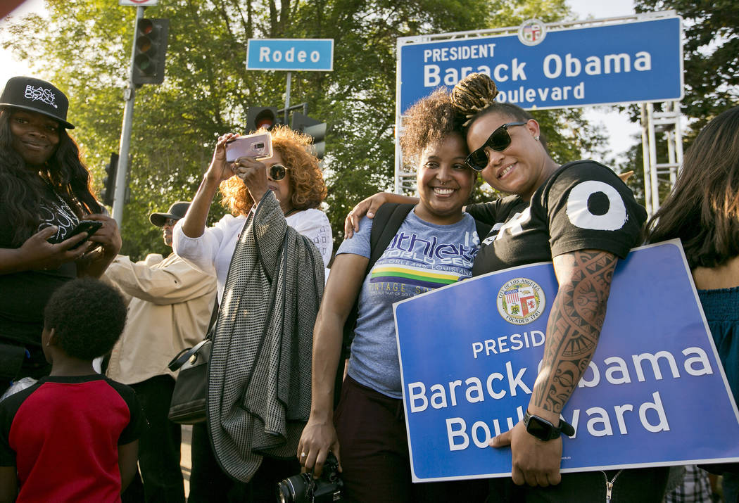 Midori Bastien, second from right, and Jameela Hammond have their photo taken with the newly un ...