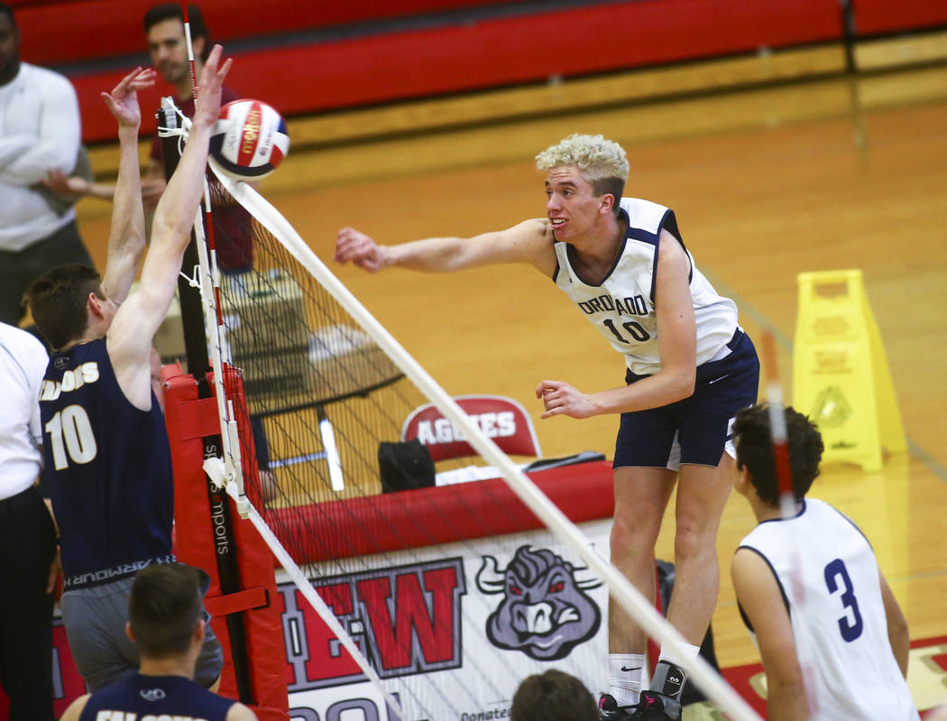 Foothill's Caleb Stearman (10) blocks a shot from Coronado's Randy Cowles (10) during the Deser ...