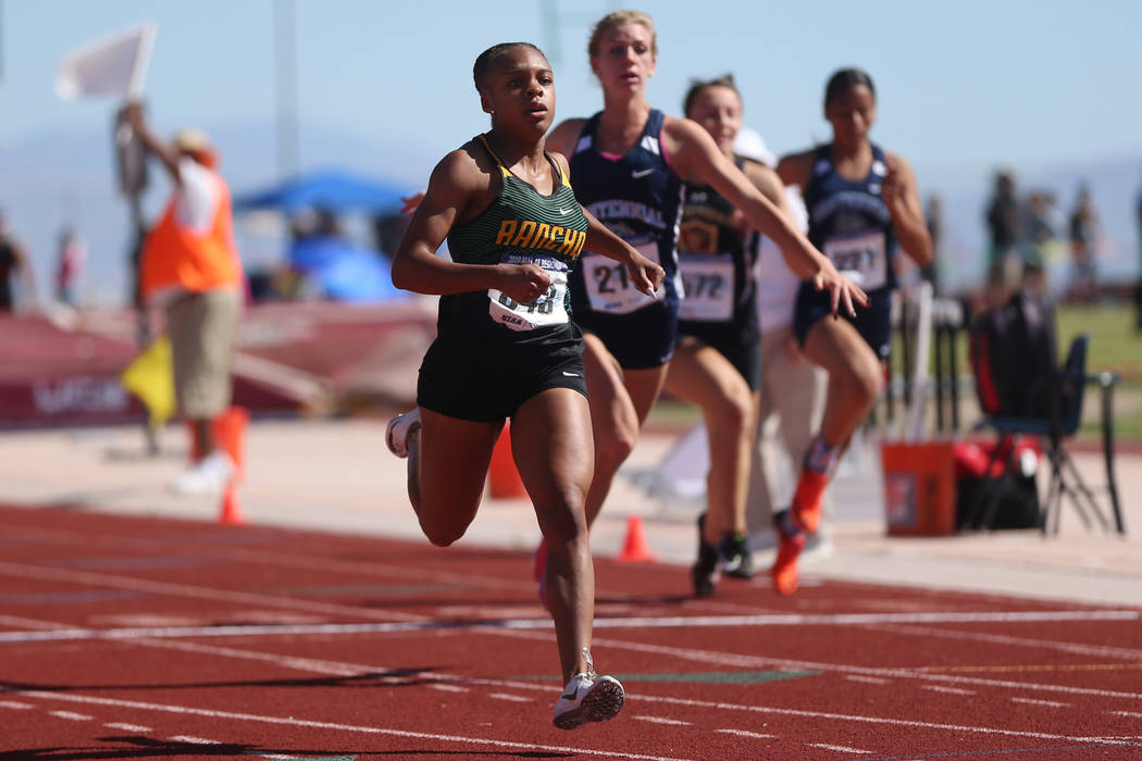 Rancho's Amir'a Edmond (843) runs for first place, followed by teammate Aniya Smith (843), and ...