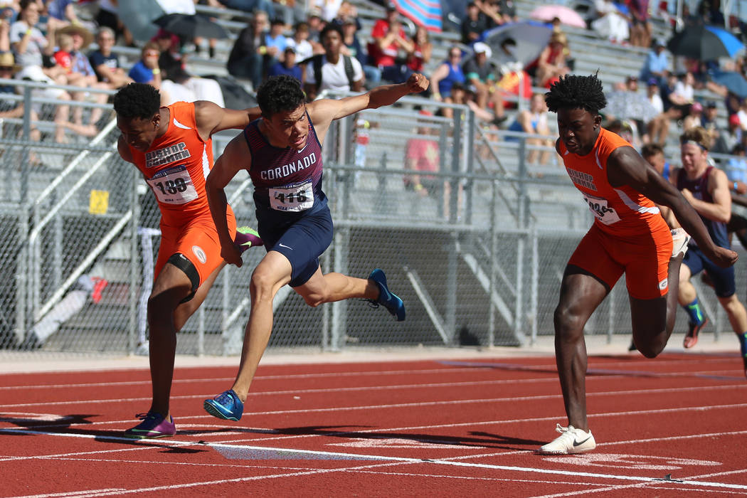 Coronado's Justin Watterson (419), center, runs for first place in the Desert Region boys 110 m ...