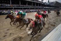 Flavien Prat ride Country House, left, to the finish line during the 145th running of the Kentu ...