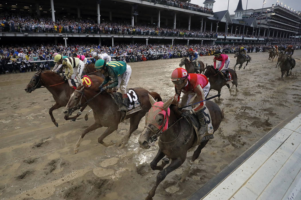 Flavien Prat ride Country House, left, to the finish line during the 145th running of the Kentu ...