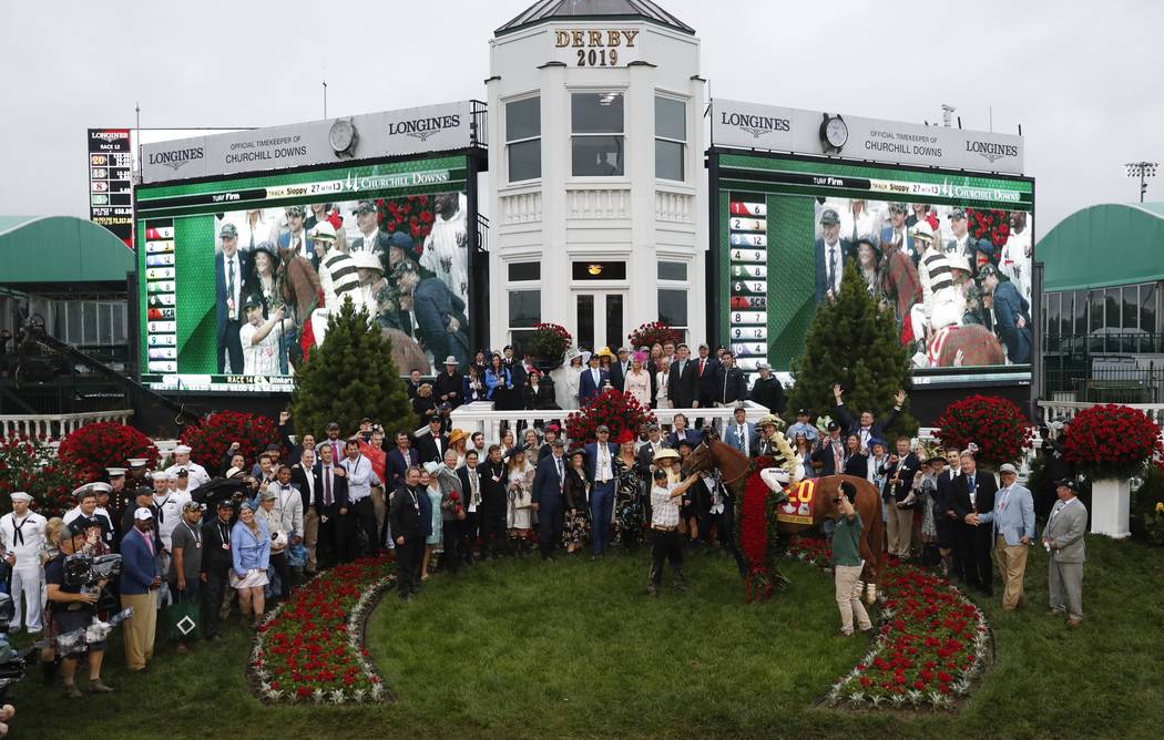 Flavien Prat celebrates after riding Country House to victory during the 145th running of the K ...