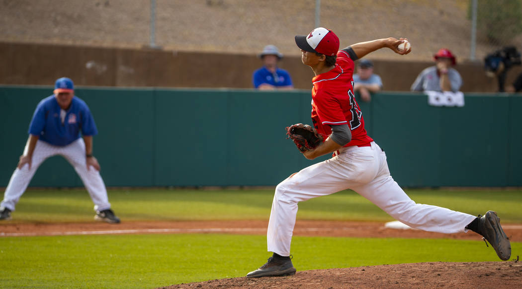 Las Vegas pitcher Nathan Freimuth (12) winds up for a throw versus Reno during their state base ...