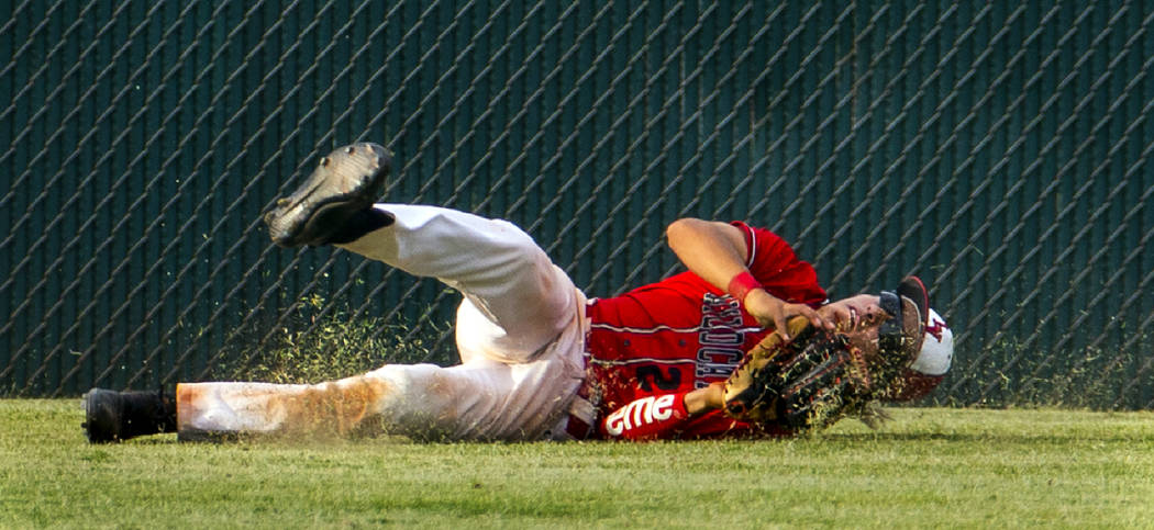 Las Vegas' Dalton Silet (23) secures a long, fly ball catch in the outfield after a circus grab ...