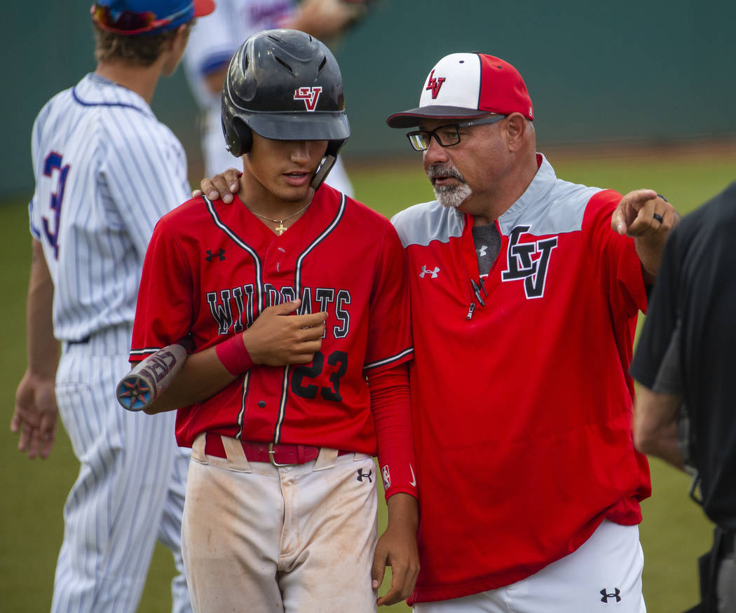 Las Vegas' Dalton Silet (23) is counseled by head coach Sam Thomas during a time out versus Ren ...