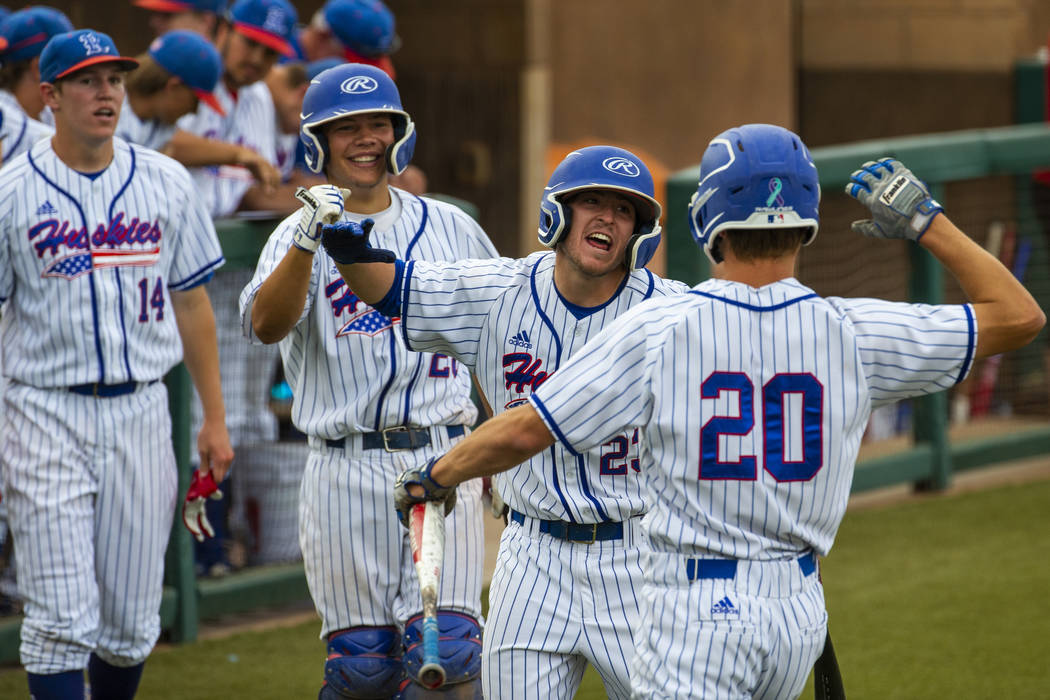 Reno players celebrate a score by teammate Coleman Schmidt (20) versus Las Vegas during their s ...