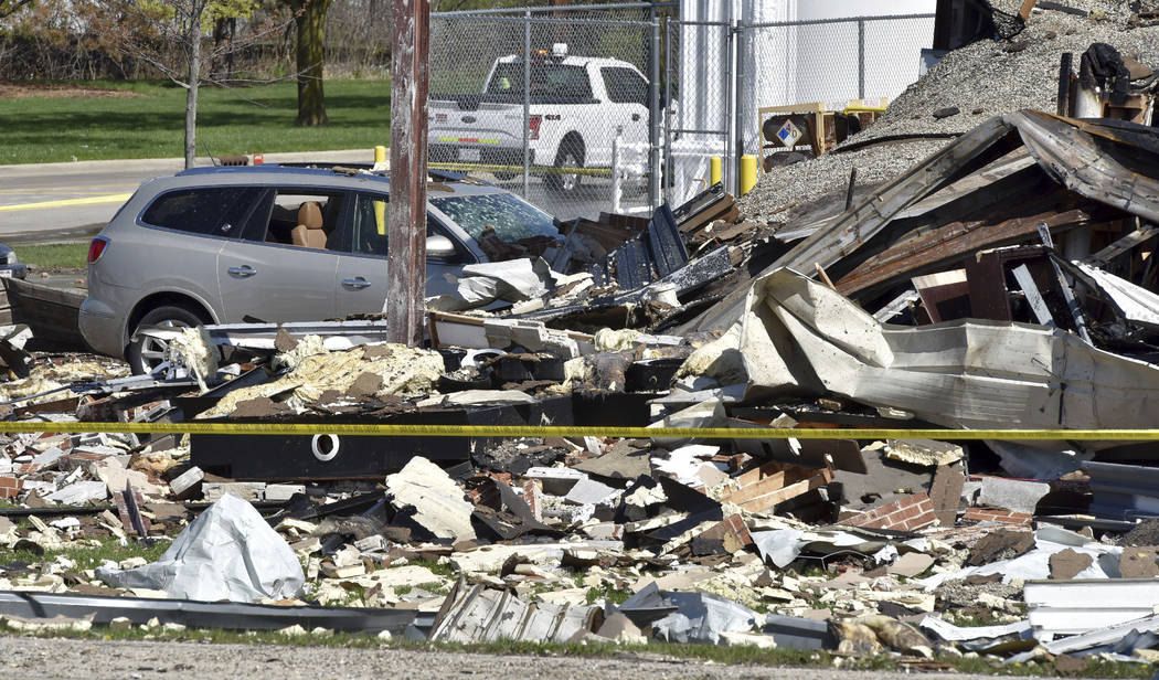 Vehicles are covered by rubble at the scene of an explosion at AB Specialty Silicones on Sunset ...