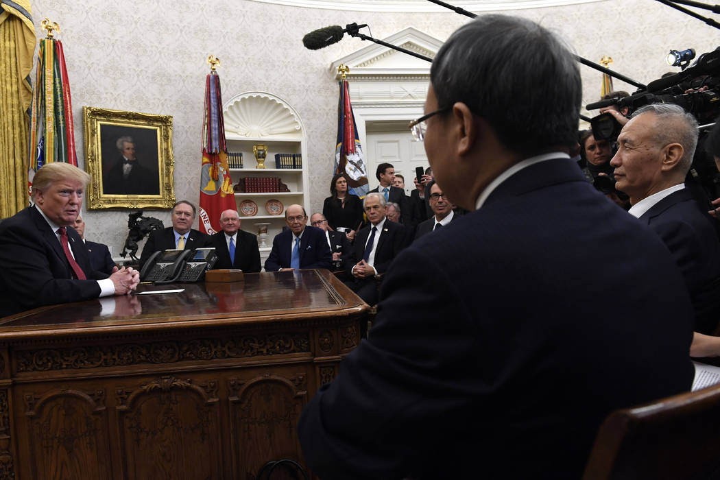 FILE - In this Jan. 31, 2019, file photo President Donald Trump, left, meets with Chinese Vice ...