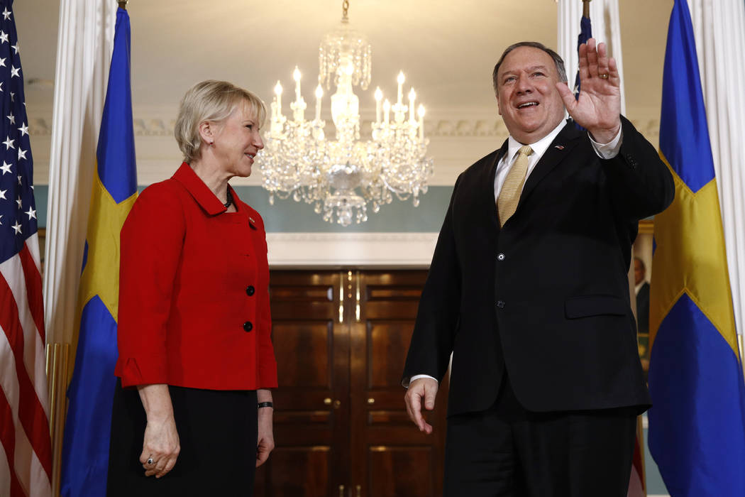 Secretary of State Mike Pompeo, right, waves as he stands alongside Swedish Foreign Minister Ma ...