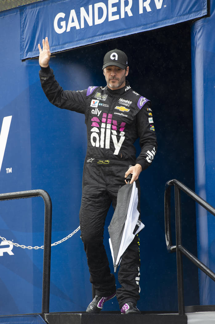 Jimmie Johnson waves during driver introductions at a NASCAR Cup Series auto race Sunday, May 5 ...