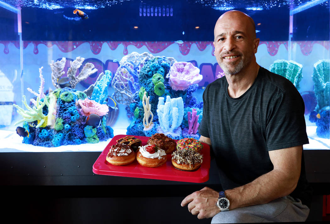 Brett Raymer, a star of the TV show "Tanked" and owner of Donut Mania, at his shop in Las Vegas ...