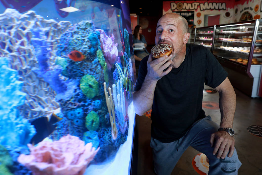 Brett Raymer, a star of the TV show "Tanked" and owner of Donut Mania, at his shop in Las Vegas ...