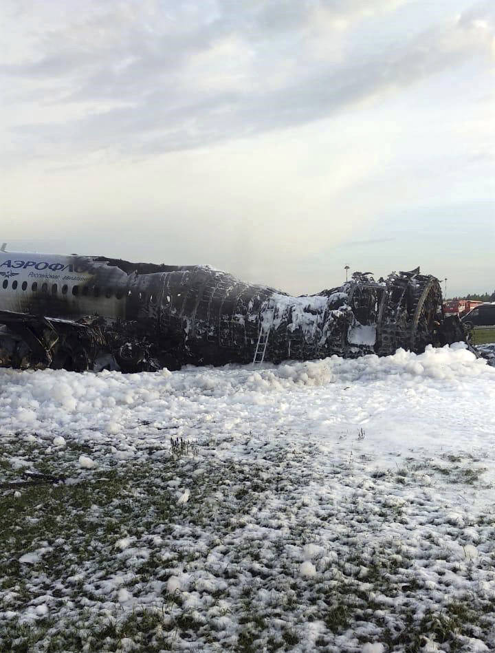 The Sukhoi Superjet 100 aircraft of Aeroflot Airlines is covered in fire retardant foam after a ...