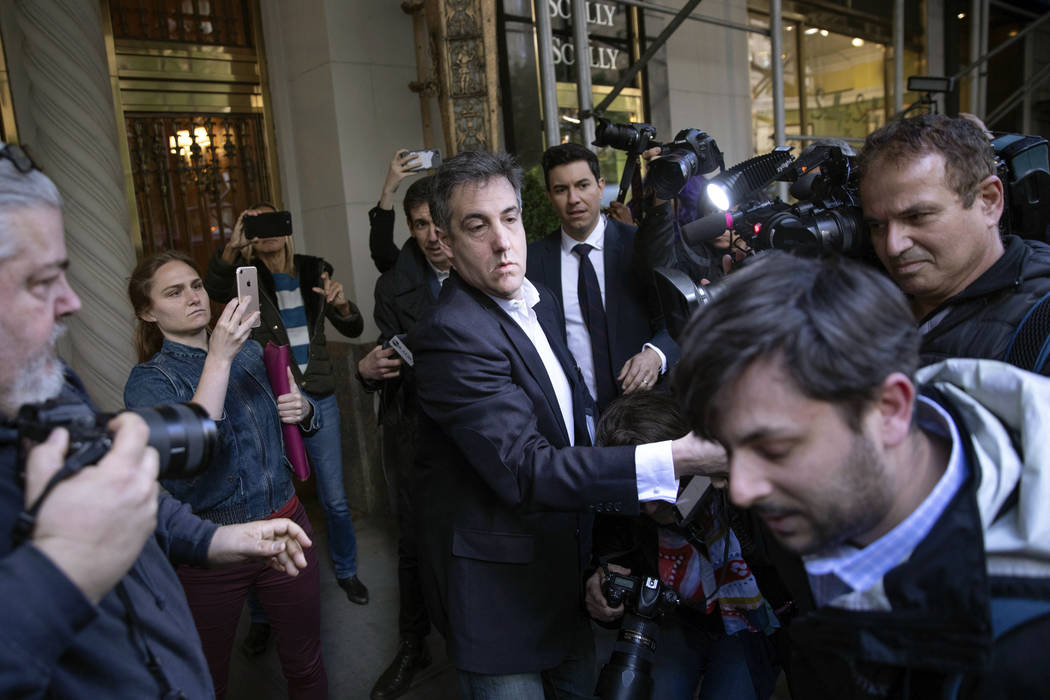 Michael Cohen, former attorney to President Donald Trump, leaves his apartment building before ...